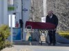 A worker with the medical examiner's office removes the body of Gabriel Wortman from a gas bar in Enfield, N.S. on Sunday, April 19, 2020. A newly released document confirms that in May 2011 police were told that Wortman — the Nova Scotia man who would later slaughter 22 people in a shooting rampage — wanted to 