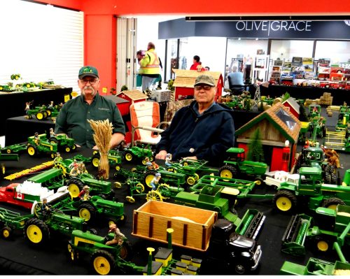 WES KEATING THE CARILLON 

Brent Chubaty and Ken Urbaniak spend a pleasant afternoon swapping John Deere stories with visitors to the annual farm toy show at the Clearspring Centre.