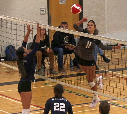 Olivia Unrau used an unorthodox punch to get the ball over the net during Steinbach Regional's four-set victory over Westgate Oct. 1. (Cassidy Dankochik The Carillon)