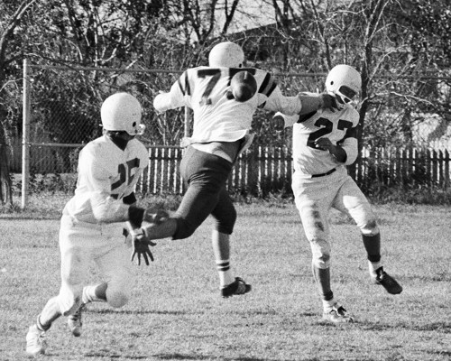 Fifteen years after quarterbacking the Steinbach-Landmark Dutchmen to three victories in their first four games of intermediate football in 1960, Wilmer Penner was still at the helm when he escaped the rush to complete a screen pass on this play as Landmark defeated St Laurent in the semi-finals on the way to a RMFL championship in 1975. (Carillon Archives)