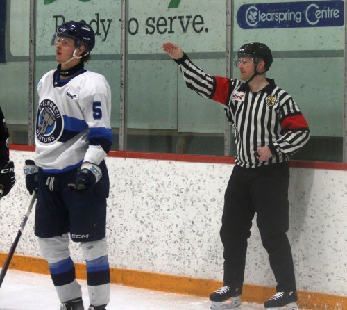 A referee signals for a penalty shot during a Steinbach Pistons' game. (Cassidy Dankochik The Carillon)