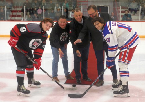 Dignitaries including La Broquerie reeve Ivan Normandeau, team president Ken Tallaire and La Verendrye MLA Konrad Narth conducted the ceremonial puck drop at La Broquerie's first CRJHL game. (Cassidy Dankochik The Carillon)