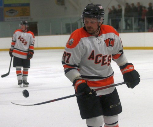 Brendan Walker flips the puck to a referee during a stoppage in play. Both Walker and the Ste Anne Aces are off to an insane start to the SEMHL season, posting back-to-back blowout victories over top four teams from last year, with Walker notching 11 points in two games. (Cassidy Dankochik The Carillon)