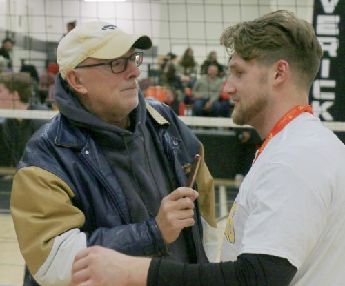 Longtime Golden West sports director Clayton Dreger interviews a coach from Rosenort School at the 2024 AA provincial volleyball championships. After 40 years broadcasting, Dreger retired Jan. 7. (Cassidy Dankochik The Carillon)