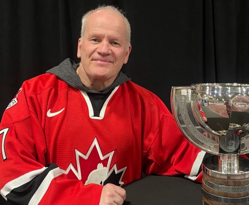 As I See It columnist James Loewen gets up close and personal with the World Junior Championship trophy during his time at the tournament in Ottawa this year. (Submitted)