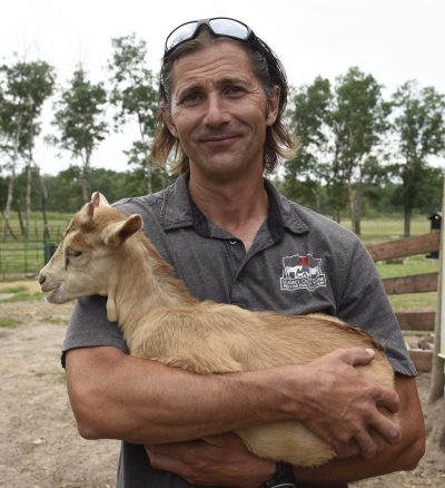 SVJETLANA MLINAREVIC CARILLON ARCHIVES
Kismet Creek Farm owner Karl Schoenrock holds Faith the baby goat on June 24, 2023. The petting zoo and  sanctuary held its first fundraiser to raise money to operate. It's takes about $30,000 annually to run the farm.