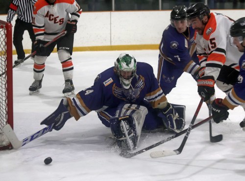 Steve Christie looks to corral a lose puck during game three of the South East Manitoba Hockey League finals. (Cassidy Dankochik The Carillon)